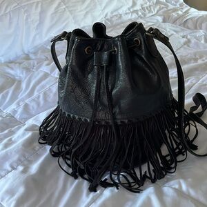 Fringed pebble leather crossbody with top drawstring closure